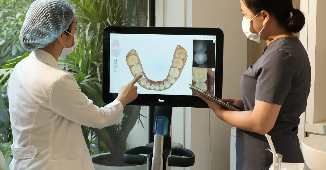 dentist checking teeth on screen greenfield dental hanoi where in vietnam
