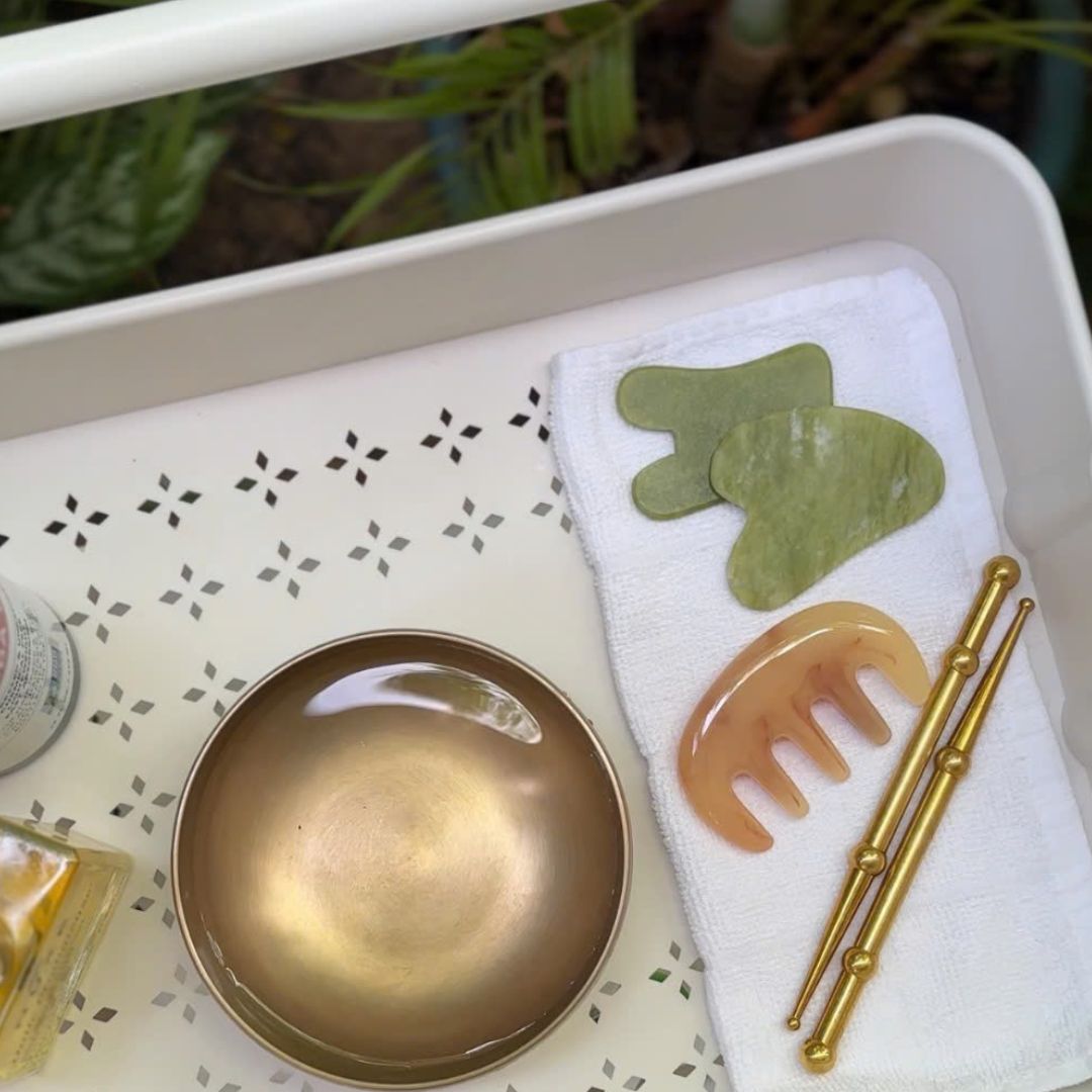 ReBloom gua sha tools and natural spa accessories prepared for facial rejuvenation ritual